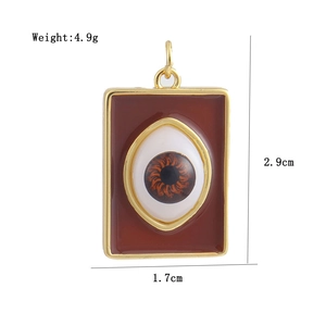 Macro shot of 18K gold plated devil eye pendant with size specs and dimensions