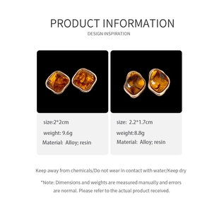Detail view of vintage amber resin earrings with gold alloy frame and size specifications