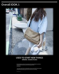 Close-up detail of khaki washed canvas messenger bag styled in an urban street scene