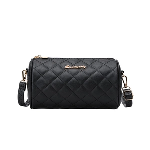 Quilted black cylinder crossbody bag with golden hardware and adjustable strap