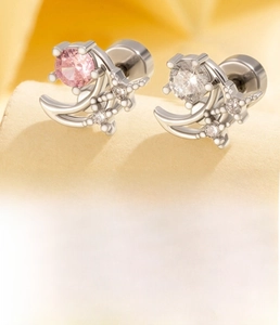 Macro view of moon and star zirconia ear studs with spiral flat back closure