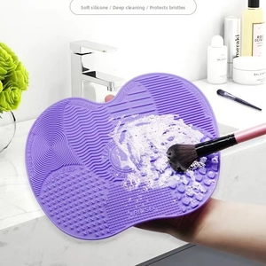 Deep cleaning purple silicone makeup brush pad with wave texture and lather detail