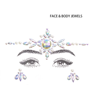 Detailed view of iridescent AB rhinestones and faux pearls for face and body decoration