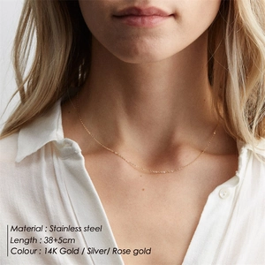 Double-layered stainless steel geometric pendant necklace in gold, silver, and rose gold