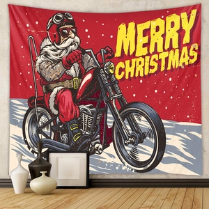 Close-up of bohemian Christmas tapestry featuring Santa riding a cruiser motorcycle