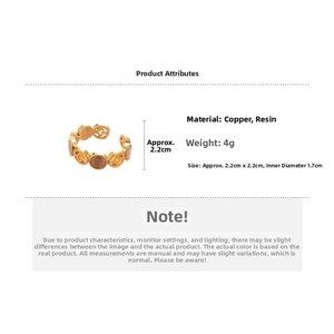 Detail view of hollow geometric ring with amber resin stone and 2.2cm size measurements