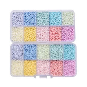 Flat lay of colorful glass seed beads in two 10-slot organizers for DIY jewelry making