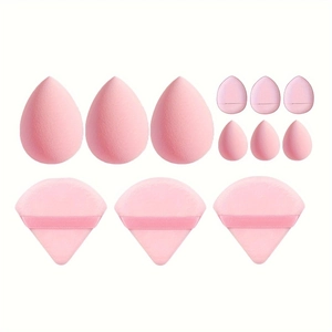 Detailed set of pink makeup sponges including large beauty blenders and triangle puffs