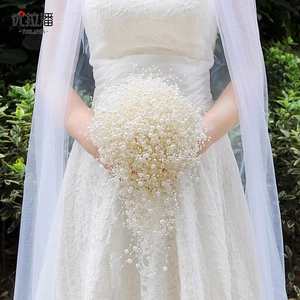 Exquisite bridal bouquet with cascading white faux pearls for elegant wedding photography