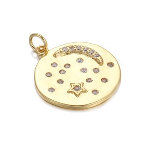Detail of gold-plated circular pendant featuring crescent moon, stars, and tiny crystals
