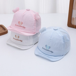Newborn soft brim baseball caps with heart embroidery in pink, white, and light blue