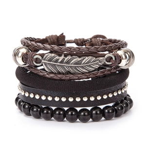 Vintage multilayer leather bracelet set featuring a silver feather charm and metal beads