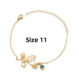 Detail of gold birthstone bracelet with blue gem and leaf pendant, size number 11