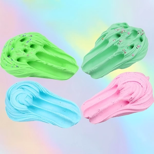 Colorful fluffy butter slime set in green, blue and pink with sprinkles for DIY clay fun