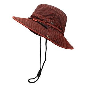 Detail view of washed cotton hiking hat with wide brim, metal eyelets and chin strap