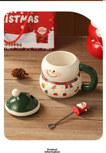 Christmas snowman ceramic mug set with lid, mixing spoon and red gift box on wooden table
