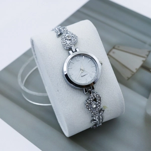 Luxurious silver quartz watch for women with rhinestone heart accents and a mesh band