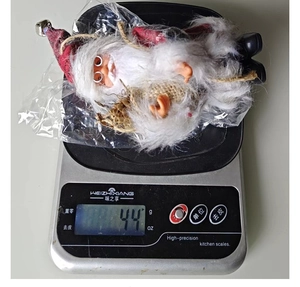 Standing Santa Claus plush doll weight check with red plaid fabric and bells