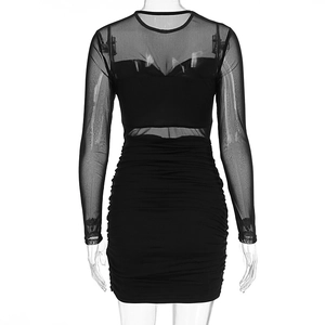 Detail view of the sexy black mesh long sleeve dress with ruched bodycon design