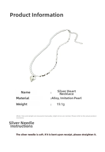 Detail view of heart pendant necklace with pearls and silver beads weighing 19.1g