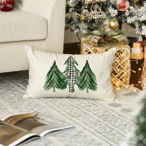 Detail view of rectangular linen pillowcase with three pine trees and Merry Christmas theme