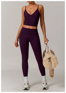 Full view of deep purple yoga set with high-waist leggings and matching sports bra vest