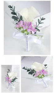 Detail of white calla lily boutonniere with purple accents and white ribbon bow