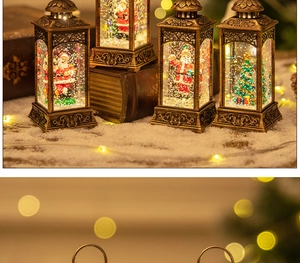 Close-up of vintage bronze snow globe lanterns with Santa and warm glowing LED lights