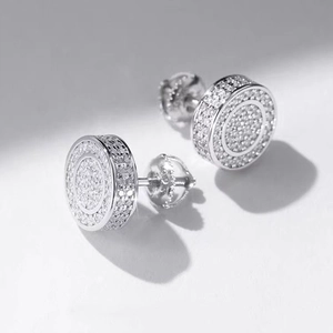 Macro detail of high-quality silver moissanite screw back earrings with iced out pavé setting