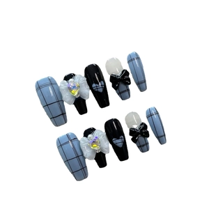 Handmade press-on nails set with blue plaid, black bows, and 3D white floral crystals