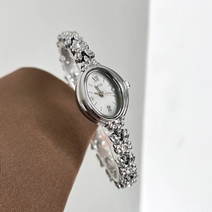 Elegant silver oval quartz watch for women with flower chain bracelet and diamond accents