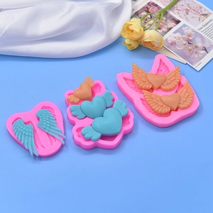 Pink heart and angel wings silicone molds for DIY baking and cake decorating crafts