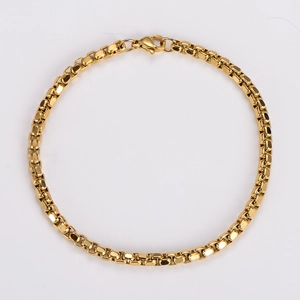 Detailed close-up of golden square box chain with lobster clasp on white background
