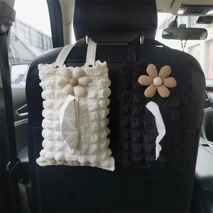 Hanging car seat tissue holder in bubble fabric with decorative floral pattern detail