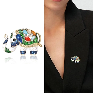 Detailed multi-color enamel elephant brooch with crystals shown on a black suit lapel
