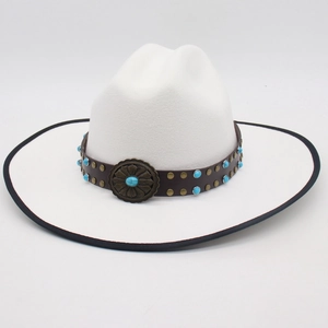 Detailed macro of white fedora hat featuring a brown leather band and turquoise studs