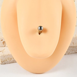 Detailed close-up of a silver G23 titanium tongue stud on a realistic flesh-colored model