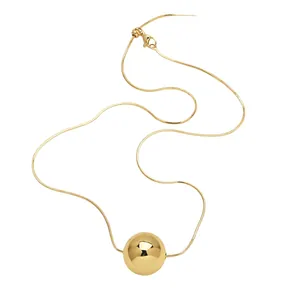 Elegant gold snake chain necklace featuring a large polished spherical heart pendant