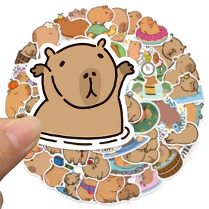 Close-up of waterproof cartoon capybara stickers for DIY scrapbooking and laptops