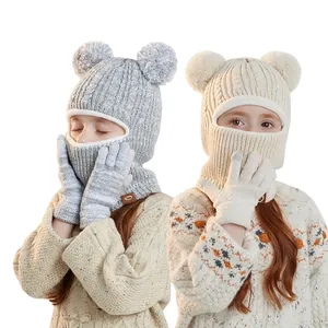 Winter knit baby hat and gloves set with dual pom-poms and fleece lining for warmth