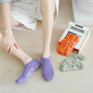 Detail of colorful breathable low-cut liner socks with Happy smiley face print