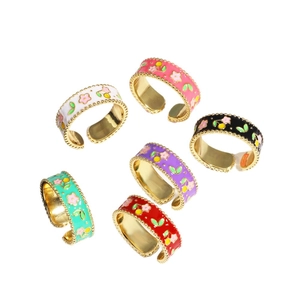 Set of six colorful enamel rings with floral cherry patterns and gold-plated details