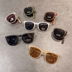 Foldable kids UV400 sunglasses in multiple colors shown in open and folded states