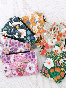 Set of six floral print credit card holders with secure snap closures and zippers