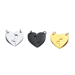 Three pairs of heart puzzle pendants in silver, black, and gold titanium steel