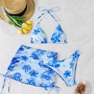 Three-piece bikini set with blue floral print including top, bottom and matching sarong