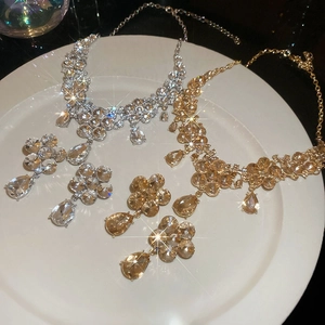 Detail of luxury flower and teardrop jewelry sets featuring sparkling crystal rhinestones