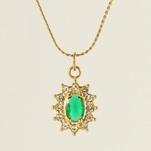 Detail of 18K gold-plated twisted chain necklace with green zircon gemstone pendant