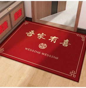 Detail of red wedding rug with gold 'Double Happiness' logo and soft Belgian velvet texture