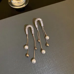 Elegant silver bow pearl tassel earrings with sparkling rhinestones and long fringe chains